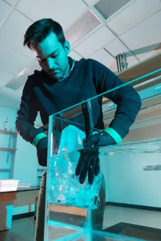 Alexander Robel sets up an experiment to study glacial melt.